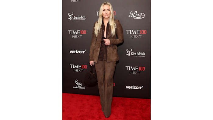 Lindsey Vonn poses in a chocolate brown suede suit.